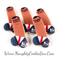 six cookies shaped like men with glasses on them