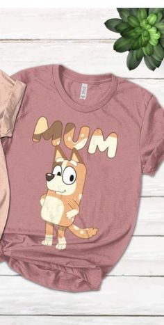 a pink shirt with an image of a dog wearing glasses and the words mum on it