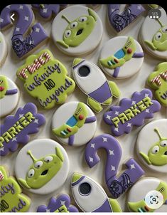 some decorated cookies are sitting on a table