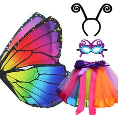 a colorful butterfly costume and headband with a mask on it's face next to a rainbow tutu