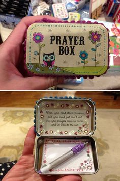 a small metal box with an owl and flower design on the front, inside and out