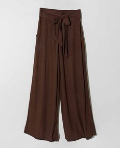 They're known as "Magic Pants" for good reason. This magical style in dark brown grows with you and is universally flattering. Slip on these wrinkle-friendly pants before a long flight, a day of meetings, or anything else on your agenda and take on any challenges in unrivaled comfort. Named for the wood that has long been beloved in India for its versatile properties. Materials: Rayon, Crinkle Crepe Measurements: High Waisted, Elastic Waist, Front Pockets, Wrap Tie, Full Length Size 1: 37" Long, Magic Pants, Noonday Collection, Long Flight, Long Flights, New Launch, British Indian, Summer Essentials, Dark Brown, Teak