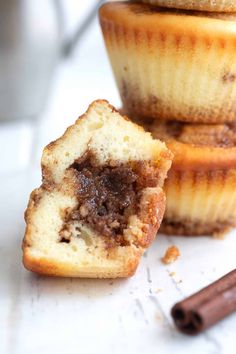 three cinnamon muffins with one cut in half