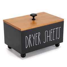 a wooden box with the words dryer sheets written on it and a black knob