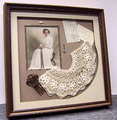 an old photo with crocheted doily and lace on display in a frame