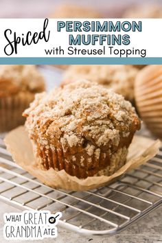 some muffins are cooling on a rack with the words spiced cinnamon muffins