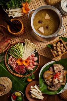 a table topped with bowls filled with different types of food