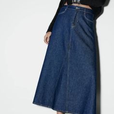 New With Tags! Brand New - Never Been Worn. Size Xs. High-Waisted Dark Denim Skirt With Front Pockets And Back Pockets. Gorgeous Front Button. Front Zip And Button Closure. Wide / Flare. Midi.