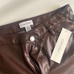 Leather Pants. Calvin Klein Size 6. New With Tag Trendy Fitted Calvin Klein Bottoms, Calvin Klein Wide Leg Bottoms For Fall, Calvin Klein Casual Fall Bottoms, Casual Calvin Klein Bottoms For Fall, Chic Calvin Klein Pants For Fall, Calvin Klein Chic Fall Bottoms, Chic Calvin Klein Bottoms For Fall, Spring Calvin Klein Mid-rise Bottoms, Chic Calvin Klein Ankle-length Pants