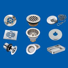 several different types of shower accessories on a blue background, including strainers and grates