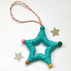 a star ornament hanging from a string