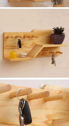 two wooden shelves with key holders on them