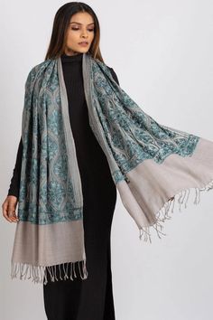 Our Surani Embroidered Shawl features fine embroidery on a soft blend of 80% wool and 20% polyester. This classically beautiful shawl showcases the intricate embroidery traditions of Northern India in stunning jewel tones on a silver base.