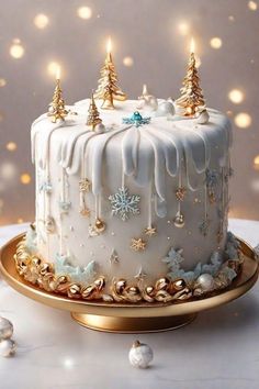 a white frosted christmas cake with gold decorations