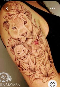 a woman's arm with a lion and cubs tattoo on the left side of her body