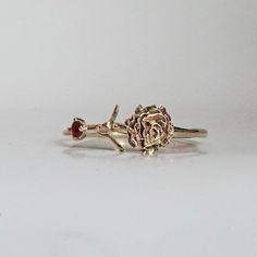 Our special collection of birth flower rings are inspired by the love of wearing something meaningful. Each birth flower is adorned with that month's birthstone. January's birth flower is Carnation and the birth stone is garnet. Materials: 14K solid gold 2mm natural garnet 1.1mm band thickness ** This item is specially made for you. Please allow 1-2 week lead time. Shipping:Domestic: Free standard shipping within the U.S.International: Free standard shipping for orders over $200 Customization:- Nature-inspired Birth Flower Ring For Anniversary, Nature-inspired Anniversary Flower Ring, Fine Jewelry Birthstone Flower Promise Ring, 14k Rose Gold Flower Ring With Birth Flower, 14k Gold Birth Flower Promise Ring, Dainty Flower Ring With Birthstone For Anniversary, May Birthstone Flower Ring As A Gift, Dainty Birthstone Flower Ring For Anniversary, Elegant Rose Gold Flower Ring With Birthstone