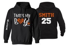 two black hoodies with orange and white basketballs on the front, one is that's my boy