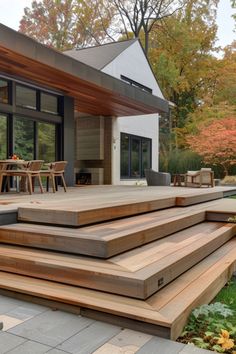 an outdoor patio with wooden steps leading up to it