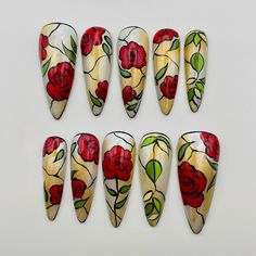 A mystical rose blooms on each nail in this enchanting press-on set. Rich red petals and green leaves evoke the beauty of floral stained glass. The elegant stiletto shape and artistic details lend an air of fantasy, perfect for adding some whimsical flair to your next event. 🌸Thank you for supporting my small business.🌸 You can reuse all the nails you purchased from us multiple times, if you handle them with care 📦𝐖𝐡𝐚𝐭 𝐜𝐨𝐦𝐞𝐬 𝐰𝐢𝐭𝐡 𝐲𝐨𝐮𝐫 𝐩𝐫𝐞𝐬𝐬 𝐨𝐧 𝐧𝐚𝐢𝐥 𝐤𝐢𝐭? 10 𝘯𝘢𝘪𝘭𝘴 𝘰𝘧 𝘺𝘰𝘶𝘳 𝘴𝘪𝘻𝘦 24 𝘢𝘥𝘩𝘦𝘴𝘪𝘷𝘦 𝘴𝘵𝘪𝘤𝘬𝘴 1 𝘯𝘢𝘪𝘭 𝘧𝘪𝘭𝘦 1 𝘤𝘶𝘵𝘪𝘤𝘭𝘦 𝘴𝘵𝘪𝘤𝘬  𝐼𝘯𝘴𝘵𝘳𝘶𝘤𝘵𝘪𝘰𝘯 𝘩𝘰𝘸 𝘵𝘰 𝘢𝘱𝘱𝘭𝘺 𝘢𝘯𝘥 𝘳𝘦𝘮𝘰𝘷𝘦 𝘵𝘩𝘦𝘮. 🌸 Customization All of my nails are hand-painted, so any new ideas and customization are available. We can even Red And Green Nail Designs, Roses Nails Design, Simple Rose Nail Art, Rose Design Nails, Red Rose Nail Art, Stained Glass Nail Designs, Stained Glass Nails Acrylic, Black Acrylic Nails With Red Roses, Black Nails With Red Roses