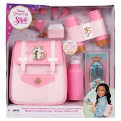 the disney princess style travel bag is pink and has its contents in it's package