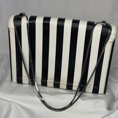 Brand: 3.1 Phillip Lim Size: 11 1/2" X 8 1/2" Vintage Or Contemporary: Contemporary Description: Super Cool And Unique Black And White Striped Leather Handbag With Heavy Silver Hardware. Chain Is Long Enough To Be Worn Crossbody, A Shoulder Bag Or Clutch. Still Smells Like Amazing Quality Leather. This Is A Statement Piece For Sure! Condition/Flaws: Good Condition W/ Some Signs Of Wear On The Leather: Fading In Some Areas On The Black Stripes, Some Discoloration At Bottom. Hardware Is Still Bright Silver (Not Tarnished) Fabric Content: Leather ***We Ship On Mondays And Fridays*** Bin I Bold Unique Beetlejuice Chic Striped Rectangular Bag, Chic Rectangular Shoulder Bag With Striped Lining, Phillip Lim Bag, 3.1 Phillip Lim, Beetlejuice, Phillip Lim, Leather Handbag, Super Cool, Silver Hardware