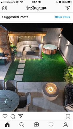 an image of a backyard at night with lights on the patio and hot tub in the back yard