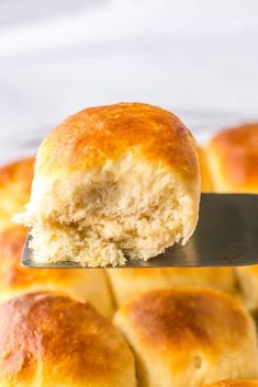 a piece of bread is being held by a spatula over the top of it