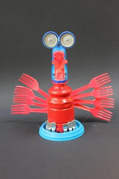 a red and blue toy with two eyes on it