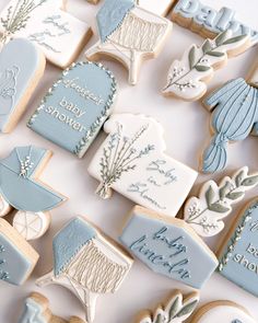 baby shower cookies are arranged on a table