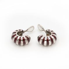 Preowned Tiffany & Co Earrings from 1980s. Earrings are crafted in Sterling Silver in shape of shrimps, with crimson red enamel stripes and omega clips.  Approximate Gross Weight: 29.40 grams  Approximate Measurement: 1" in length x 5/8" wide  Hallmarks: Tiffany & Co 925 Tiffany And Co Earrings, Vintage Enamel Drop Earrings, Red Enamel Clip-on Jewelry, Red Enamel Clip-on Earrings, Vintage Red Clip-on Earrings, Red Enamel Vintage Earrings, Vintage Enamel Clip-on Earrings, Luxury Vintage Enamel Clip-on Earrings, Tiffany & Co.