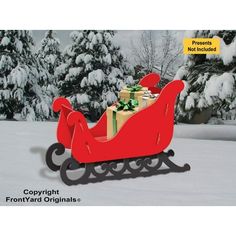 a red sleigh with presents on it in front of snow - covered trees