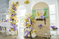 the flowers are all over the room and there is a bike parked next to it