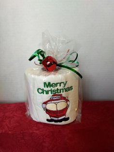 a white toilet paper wrapped in plastic with a merry christmas message on it's side