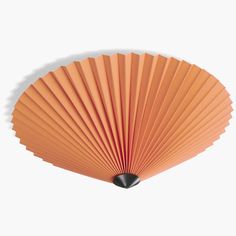 an orange fan on a white background with shadow from the top to the bottom,