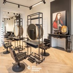 a hair salon with chairs and mirrors