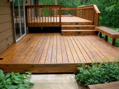 a wooden deck with steps leading up to it