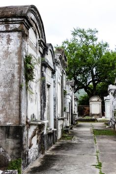 an old cemetery with many headstones and trees