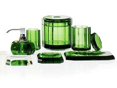 a green bathroom set with soap dispenser, toothbrush holder and other items