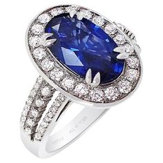 Our new platinum custom natural Ceylon sapphire ring features an oval-cut blue sapphire that measures 11.34 x 6.78 x 3.89 mm and weighs 2.37 carats. The sapphire has a GIA color grade of B 6/4, which means it has a medium-dark, moderately strong blue color with no secondary colors. It is also GIA-certified. The sapphire is set with 62 round brilliant cut diamonds weighing 0.62 carats, with VS-SI clarity and G-H color. The sapphire displays perfect tone and saturation, giving off a beautiful bright blue hue. Our master jeweler has set this stunning sapphire into a custom ring, surrounded by a halo of large brilliant-cut diamonds. Three rows of diamonds accent both sides of the ring shank, beautifully showcasing the natural sapphire. Be sure to check out the accompanying pictures to see this Bills Paid, Platinum Sapphire Ring, Ceylon Sapphire Ring, Secondary Colors, Ceylon Blue Sapphire, Yellow Sapphire Rings, Contemporary Engagement Rings, Perfect Blue, Ring Shank