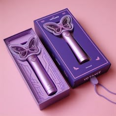 an electric hair dryer in a purple box