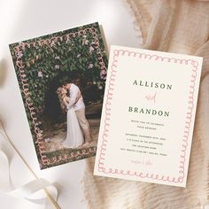 an image of a wedding card with the bride and groom on it next to some flowers