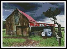 an old barn with a red roof sits in the middle of a grassy field next to a tree