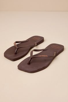 No closet is complete without an iconic go-to look like the Havaianas Slim Square Brown Flip Flops! Two rubber straps (with an embossed logo) shape a classic thong upper atop a comfortable textured foam sole with a trendy square toe bed. Pair these essential cuties with all your sunny days and getaways! Available in Euro sizes only. 0. 5" rubber heel. Cushioned foam insole. Rubber sole has nonskid markings. Man made materials. Imported. Lulus | Slim Square Brown Flip Flops | Size 35/36. Brown Leather Flip Flops, Brown Flip Flops, Logo Shapes, No Closet, Leather Flip Flops, Shoe Inspo, Rubber Heels, Embossed Logo, Sunny Days