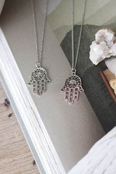 Antique silver Hamsa pendant hangs from a chain of your choice. Choose the desired chain length from the drop-down menu. Hamsa Evil Eye is said to be worn to bring good luck! D E T A I L S Antique Silver Hamsa measures 33x23mm CHAIN CUSTOMIZATION You may choose your desired chain length and style from the drop-down menu or contact me for length customization. If you DO NOT leave me a note, I will send you a 28 inches chain. Lengths 26 inches and shorter will close with a clasp. Above 26 inches h Necklaces Layering, Hamsa Evil Eye, Evil Eye Hamsa, Yoga Necklace, Hamsa Pendant, Layering Necklaces, Hamsa Necklace, Long Necklaces, Hamsa Hand