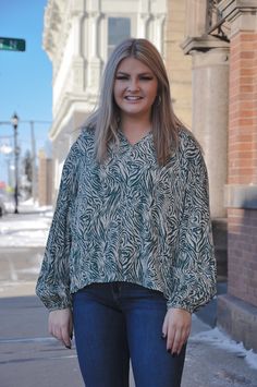 The Soft Crinkle Zebra Print Blouse is a unique blend of comfort and style. Crafted from soft crinkle gauze fabric, this top offers a lightweight and breathable feel. The zebra print adds a touch of wild charm to your outfit. The ruffle edge neckline enhances the design with a touch of femininity. With long sleeves, this top is suitable for various occasions and seasons. Whether you're aiming for a casual day out or looking to make a statement, the Soft Crinkle Zebra Print Blouse seamlessly comb Green Zebra, Form Fitting Dress, Gauze Fabric, Print Blouse, Clothing Co, Zebra Print, Printed Blouse, New Outfits, Comb