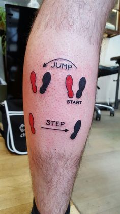 a man's leg with the words jump start and step painted on it