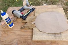 a piece of wood with a circular cut out on it and glue next to it