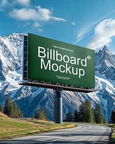 billboard sign on road with mountains in the background