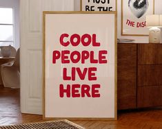 there is a sign that says cool people live here in red on the white poster