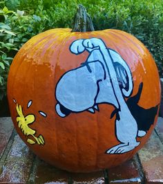 a painted pumpkin with a cartoon character on it